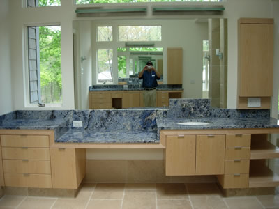 Private Residence Blue Bahia granite, very rare and quarried from boulders in Brazil, was specified for this Master Bath Retreat.  Note the varying levels of the vanities.  Prescott Stone collaborated closely with the cabinet and mirror shops to execute this design.