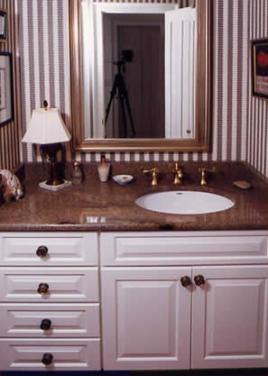 Private Residence, Hillsborough. This vanity is made of a stone that is no longer readily available, Golden Juperana. The category of granites known as Juperanas are typified by fine to medium grain crystals that swirl and "move". This group of stones is often appealing to people looking